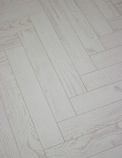 Timeless herringbone pattern laminate flooring with a lifetime warranty
